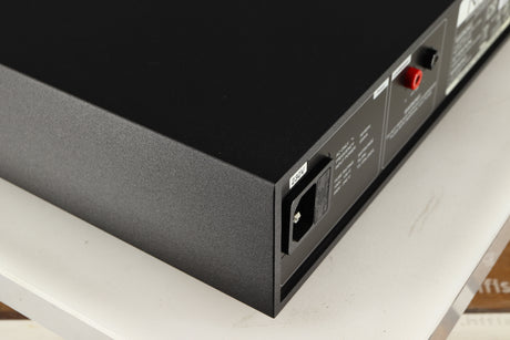 Rear right corner of a used Naim NAP250 DR Power Amplifier in a black finish