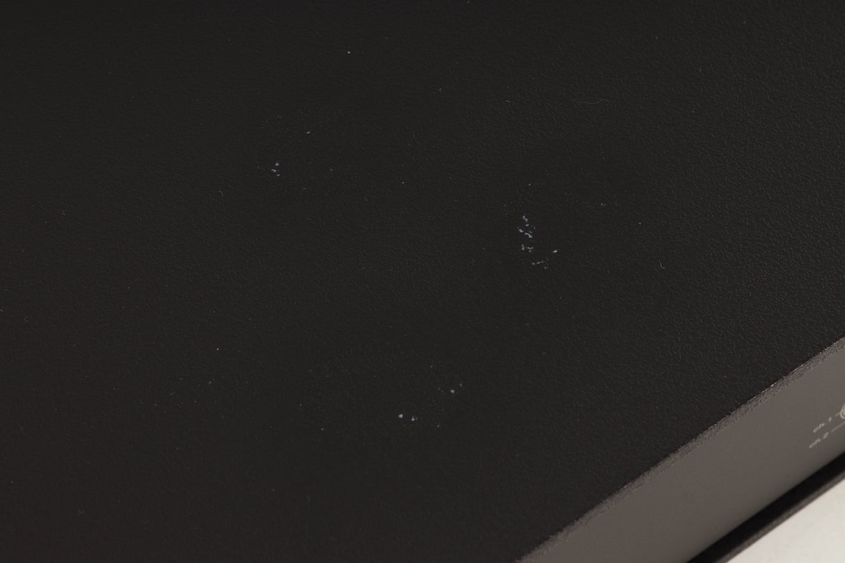 Close up of a used Naim NAP250 Power Amplifier in a black finish showing marks on top
