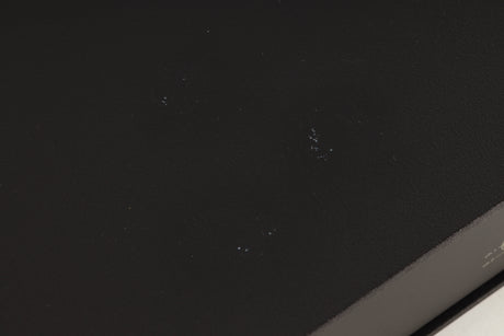 Close up of a used Naim NAP250 Power Amplifier in a black finish showing marks on top