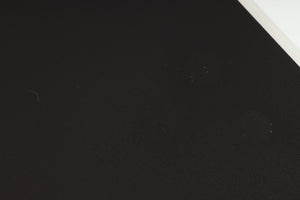 Close up of a used Naim NAP250 Power Amplifier in a black finish showing marks on top