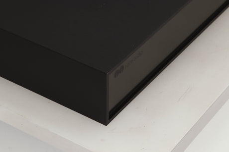 Front left corner of a used Naim NAP250 Power Amplifier in a black finish