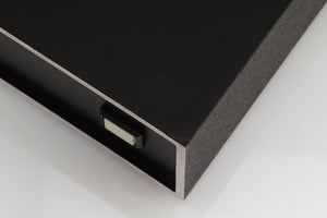 Close up of a used Naim NAP250 Power Amplifier in a black finish showing small blemish and foot mark on top