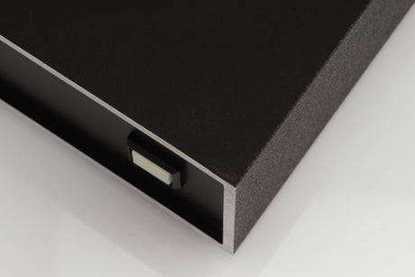 Close up of a used Naim NAP250 Power Amplifier in a black finish showing small blemish and foot mark on top