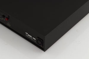 Rear left corner of a used Naim NAP250 Power Amplifier in a black finish