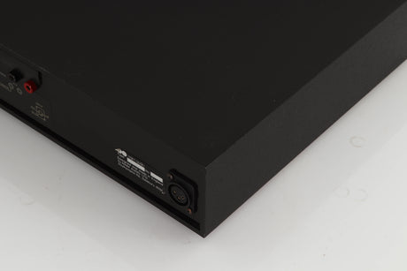 Rear left corner of a used Naim NAP250 Power Amplifier in a black finish