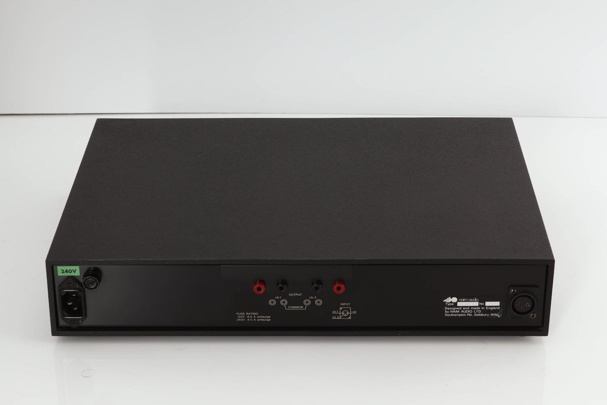 Rear view of a used Naim NAP250 Power Amplifier in a black finish showing Mains Input and Speaker Outputs