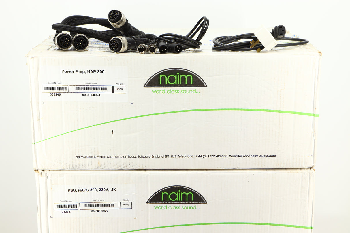Box of a used Naim NAP300DR Power Amplifier and Power Supply showing mains cable, burndy leads, and SNAICs