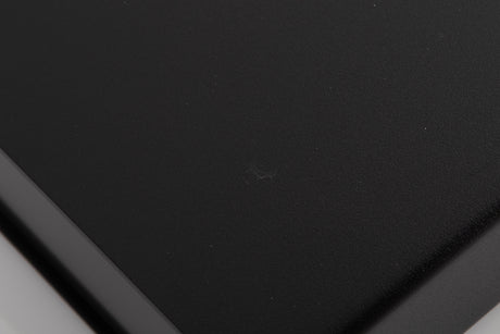 Close up of a used Naim NAP90 Power Amplifier in a Black finish showing mark and scratches on top