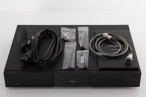 Top of a used Naim ND5 XS2 Media Player in a Black finish showing Manual, SNAIC5, Mains Cable, Wi-Fi Antennas, Bluetooth Antenna and BNC Adaptor