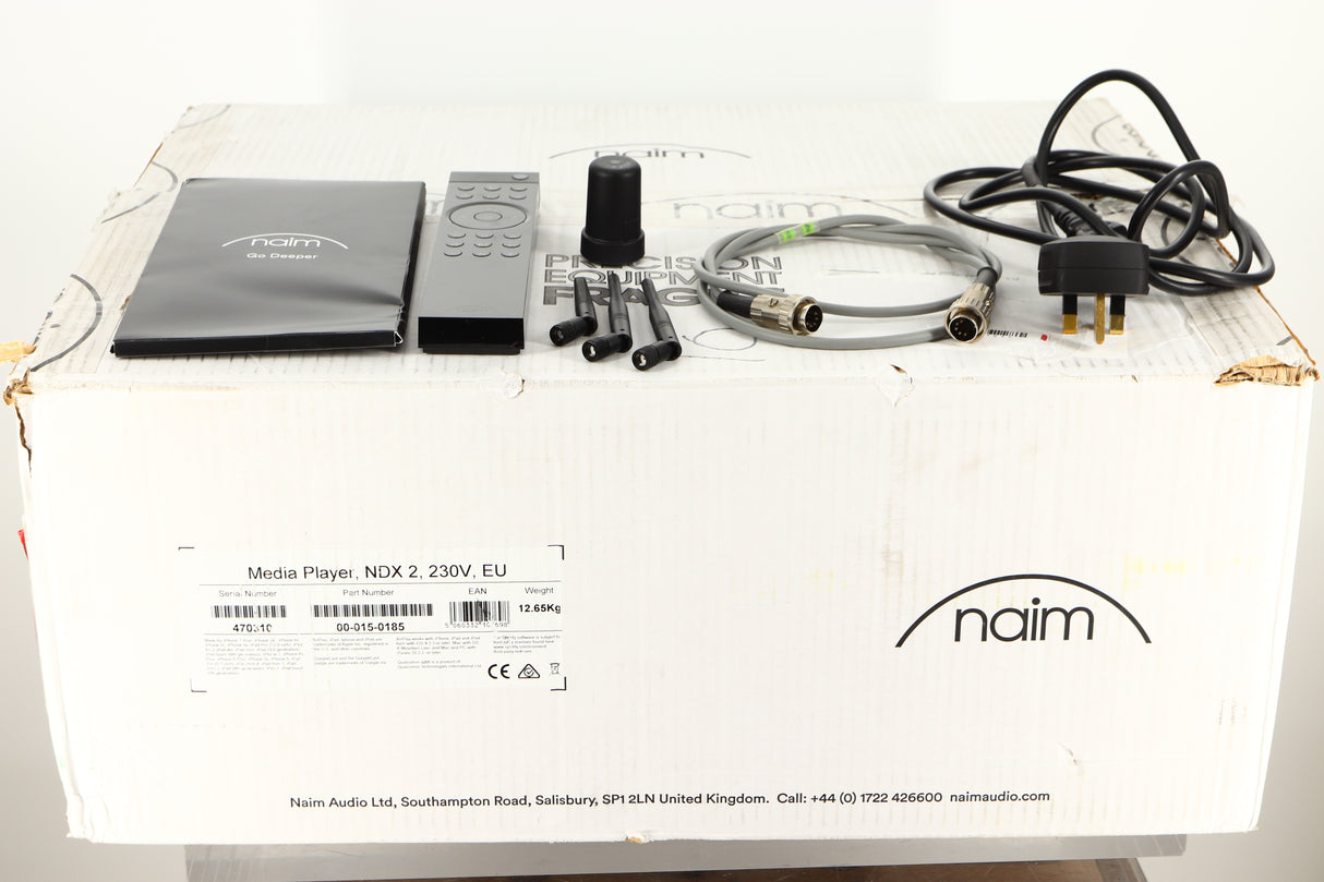 Box of a used Naim NDX 2 Network Streamer with mains cable, manual, remote, SNAIC, 3x antenna, and burndy plug