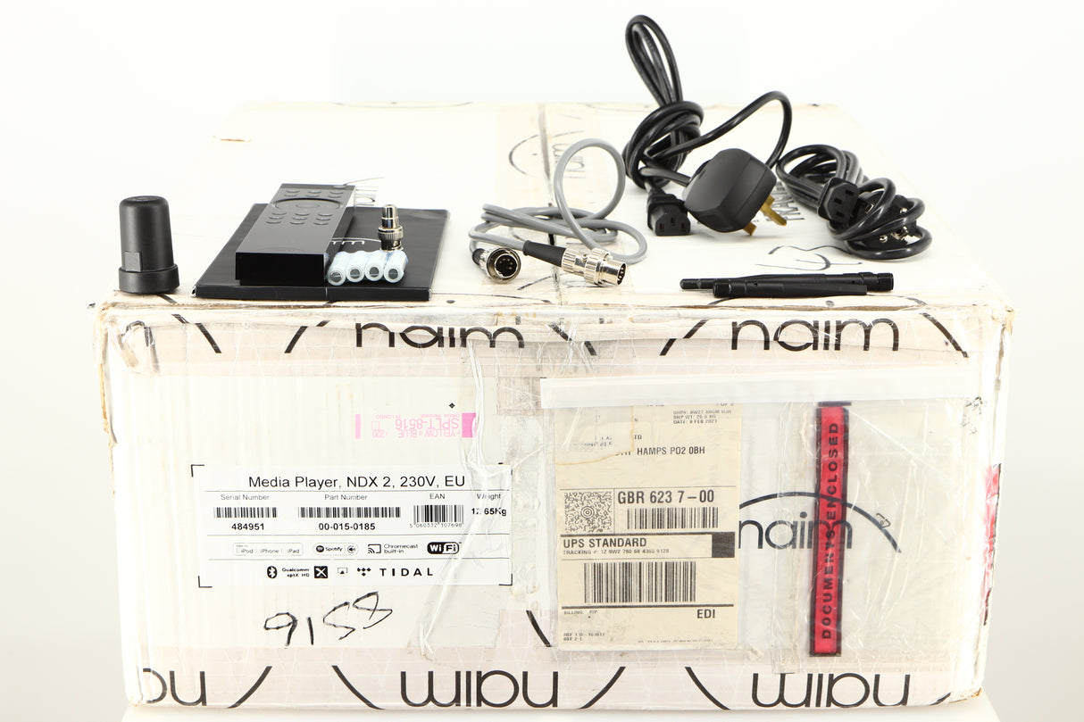 Box for a used Naim NDX2 Network Streamer in a black finish showing Manual, Mains Cable, Schuko Cable, Link Plug, BNC Adapter, 4x Batteries, SNAIC5, Remote, 2x Wi-Fi Aerials and Bluetooth Aerial