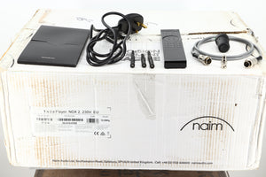 Box of a used Naim NDX2 Streamer showing Mains Cable, Manual, Remote, SNAIC, Burndy Plug, BNC Adaptor, 2x Wifi Antenna, Bluetooth Antenna 