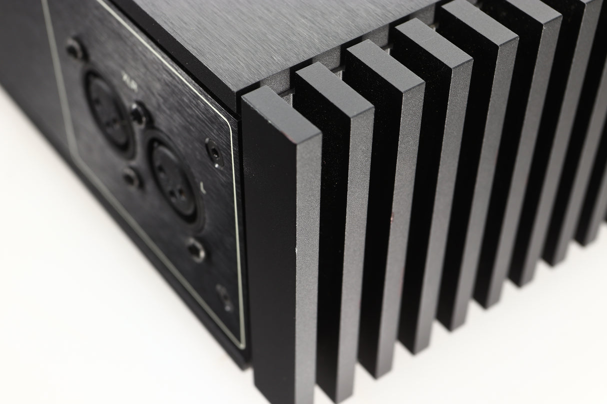 Front view of a used Naim New Classic NAP250 Power Amplifier in a black finish showing tiny nick on rear left corner 