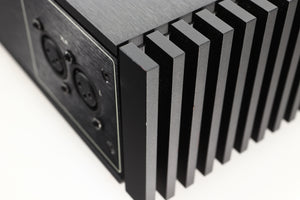 Front view of a used Naim New Classic NAP250 Power Amplifier in a black finish showing tiny nick on rear left corner 