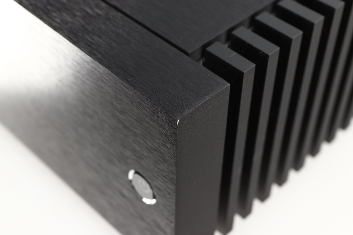 Close up of a used Naim New Classic NAP250 Power Amplifier in a black finish showing small nick on front right corner 