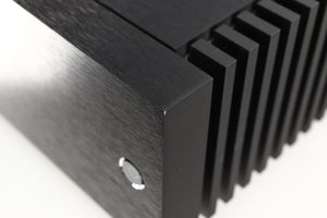 Close up of a used Naim New Classic NAP250 Power Amplifier in a black finish showing small nick on front right corner 