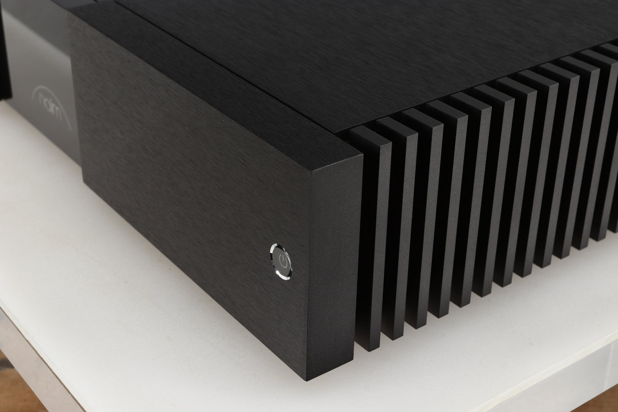 Front right corner of a used Naim NPX300 Power Supply in a black finish