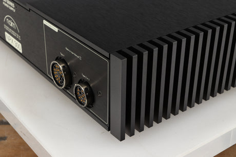Rear left corner of a used Naim NPX300 Power Supply in a black finish