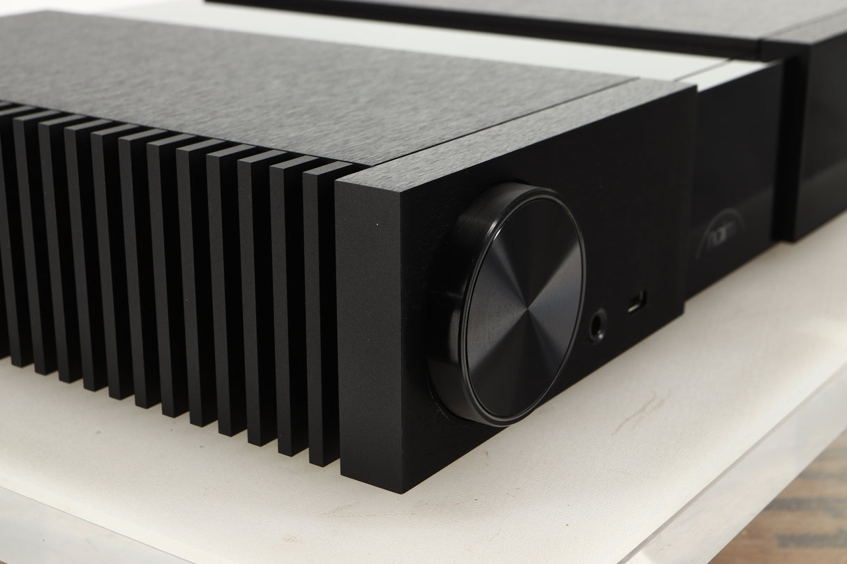 Front left corner of a used Naim NSC 222 Streaming Pre Amplifier in a black finish