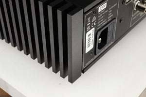 Close up of a used Naim NSC222 Pre Amplifier in a black finish showing small scratch on rear right corner