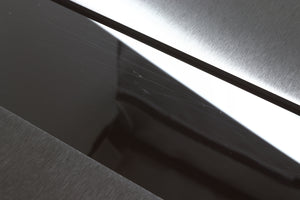 Close up view of a used Naim NSS333 Streamer showing scratches on the top gloss section