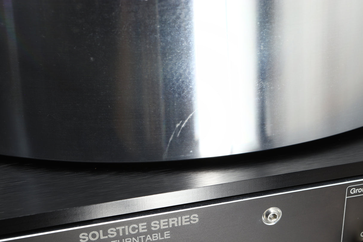 Close up of a used Naim Solstice Special Edition Turntable in a black finish showing 2 scratches on platter