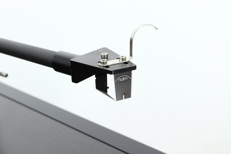 Close up of a used Naim Solstice Special Edition Turntable in a black finish showing the cartridge