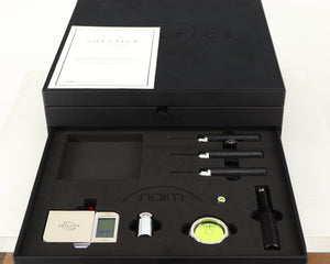 Box for a used Naim Dust Protector and Manual in a black finish showing 4x Screwdrivers, Stylus Gauge, Authentication Certificate and 2x Spirit Levels