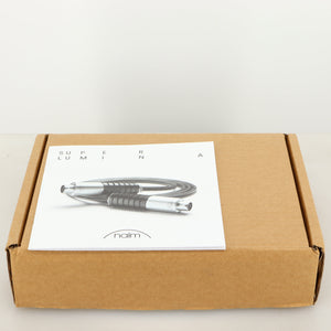 Outer box for used Naim Super Lumina 4PIN DIN-XLR Interconnect Cables in a black finish showing Manual