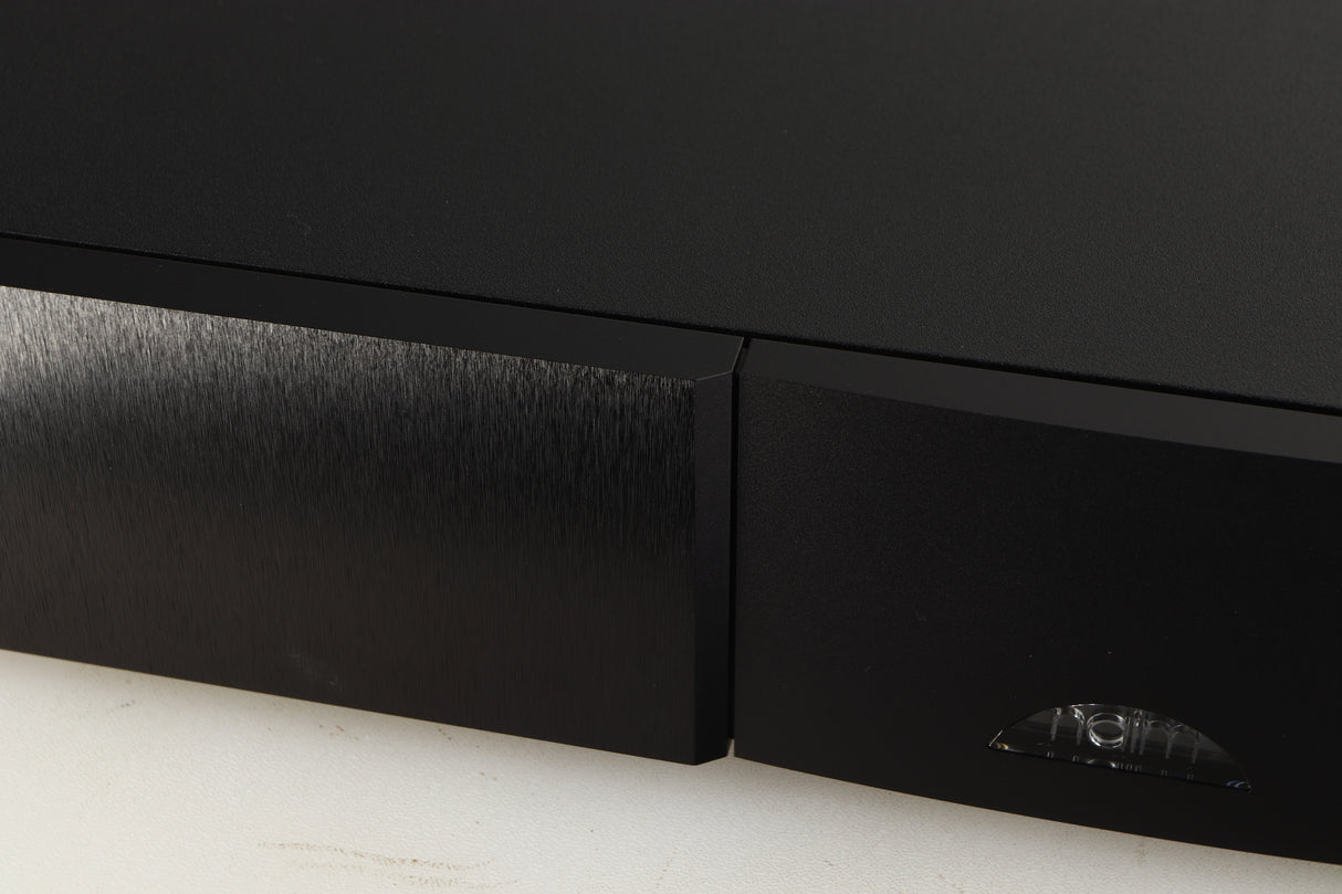 Close up of a used Naim Supercap DR Power Supply in a black finish showing small mark on fascia