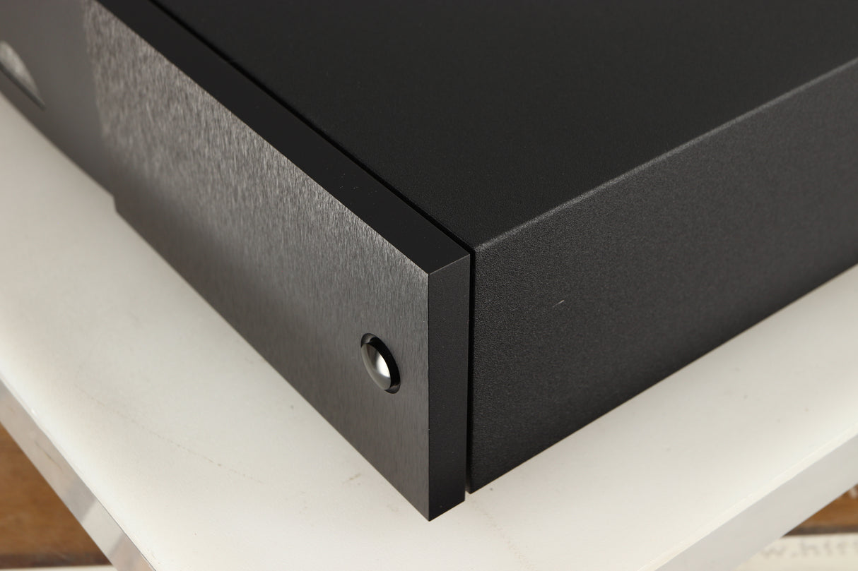 Front right corner of a used Naim Supercap DR Power Supply in a black finish