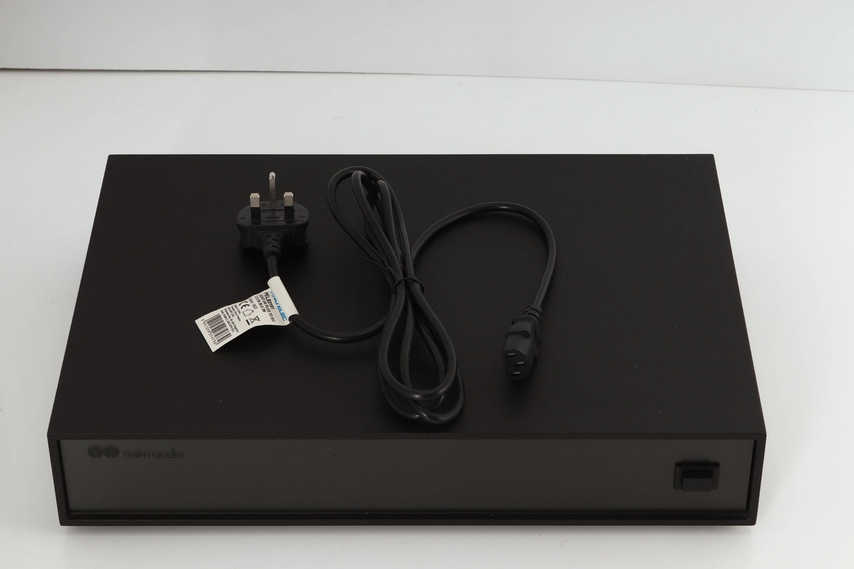 Top of a used Naim Supercap Power Supply in a black finish showing Mains Cable