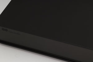 Close up of a used Naim Supercap Power Supply in a black finish showing some of the fascia