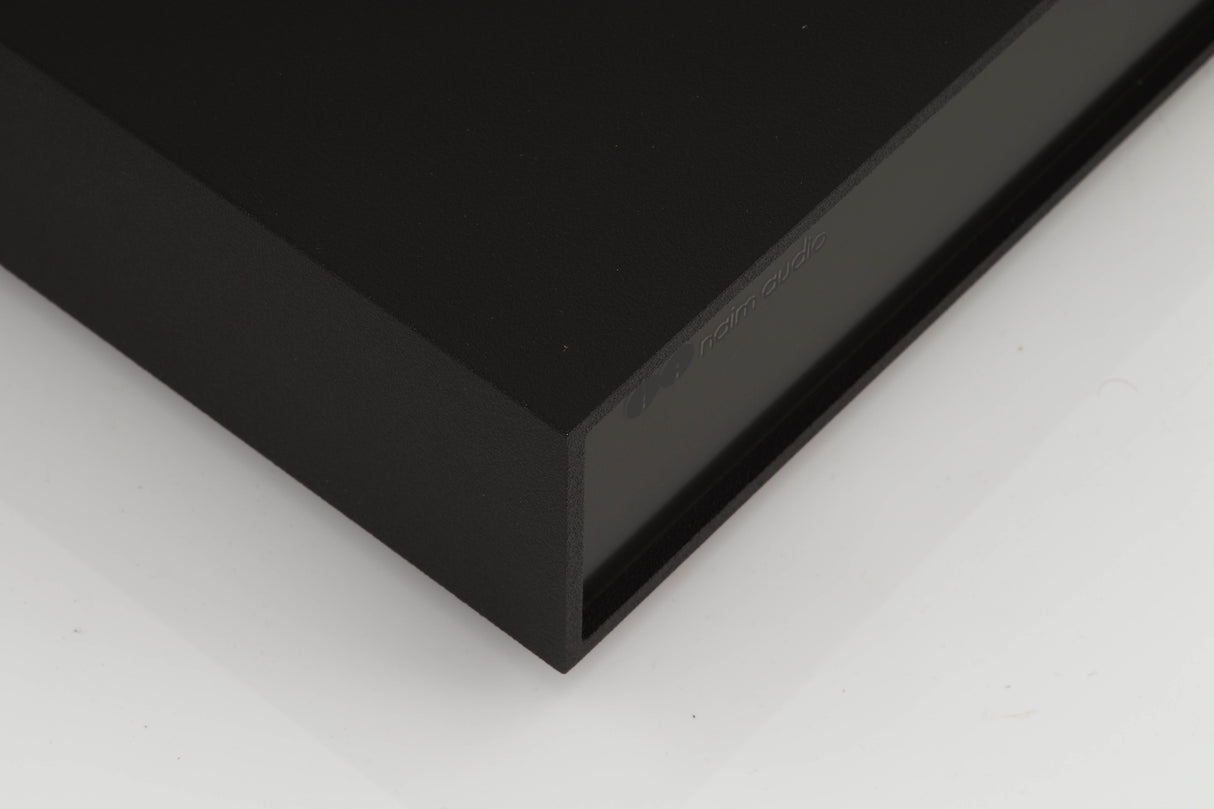 Front left corner of a used Naim Supercap Power Supply in a black finish