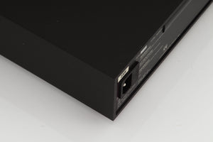 Rear right corner of a used Naim Supercap Power Supply in a black finish