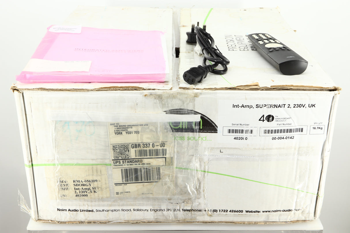Box of a used Naim Supernait 2 Integrated Amplifier showing a main cable, remote, 2x batteries and a manual