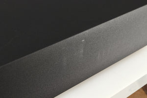 Close up of a used Naim Supernait 3 Integrated Amplifier in a black finish showing some scratching on left side 