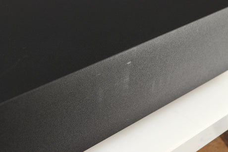 Close up of a used Naim Supernait 3 Integrated Amplifier in a black finish showing some scratching on left side 