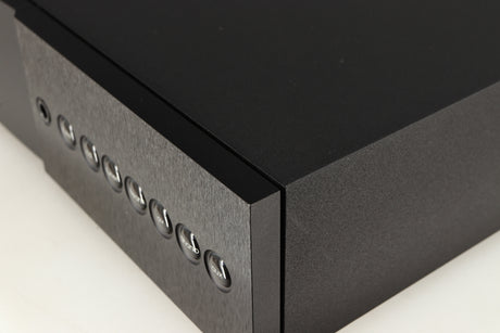 Close up of a used Naim Supernait 3 Integrated Amplifier in a black finish showing light scratch on right side 
