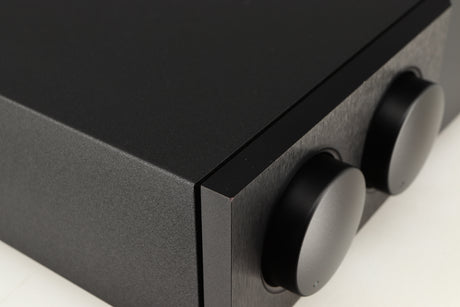 Close up of a used Naim Supernait 3 Integrated Amplifier in a black finish showing small chip on front left corner 