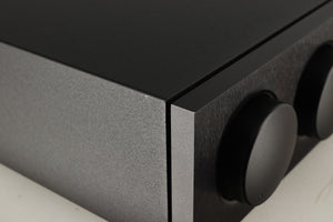 Close up of a used Naim Supernait 3 Integrated Amplifier in a black finish showing very light scratch on left side