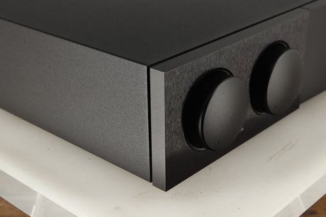 Front left corner of a used Naim Supernait 3 Integrated Amplifier in a black finish
