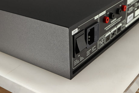Rear right corner of a used Naim Supernait 3 Integrated Amplifier in a black finish