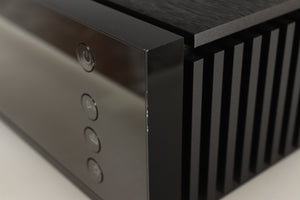 Close up of a used Naim Uniti Atom HDMI Integrated System in a black finish showing nick on front right corner 