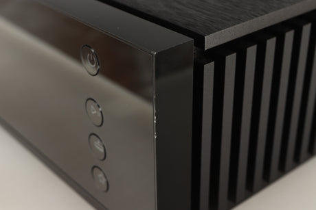 Close up of a used Naim Uniti Atom HDMI Integrated System in a black finish showing nick on front right corner 