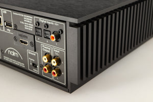 Rear left corner of a used Naim Uniti Atom HDMI Integrated System in a black finish