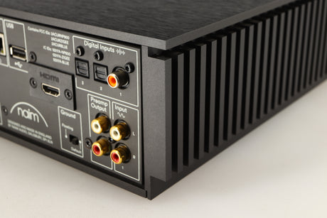 Rear left corner of a used Naim Uniti Atom HDMI Integrated System in a black finish
