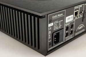 Rear right corner of a used Naim Uniti Atom HDMI Integrated System in a black finish