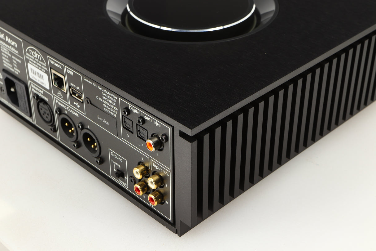 Rear left corner of a used Naim Uniti Atom Headphone Edition Streaming Amplifier in a black finish