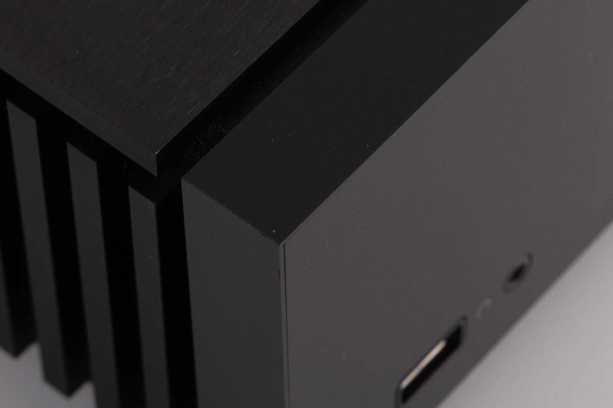 Close up of a used Naim Uniti Atom Integrated System in a Black finish showing small dinks on front left corner